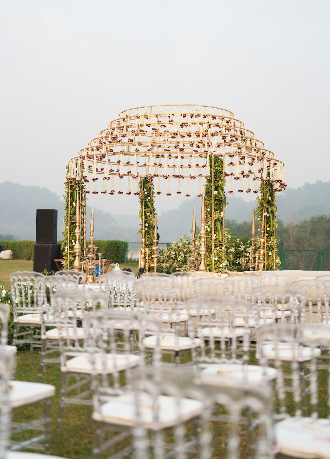 A floral wedding mandap with white seating
